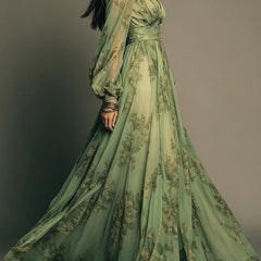 Green floral maxi dress, long puff sleeves, fitted bodice and full flowing skirt