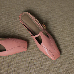Pink leather mules on display, open heel, gold buckle sling strap, low block heel