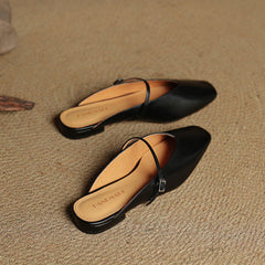 Pair of genuine leather mule flats: black uppers with ankle strap and pointed toe