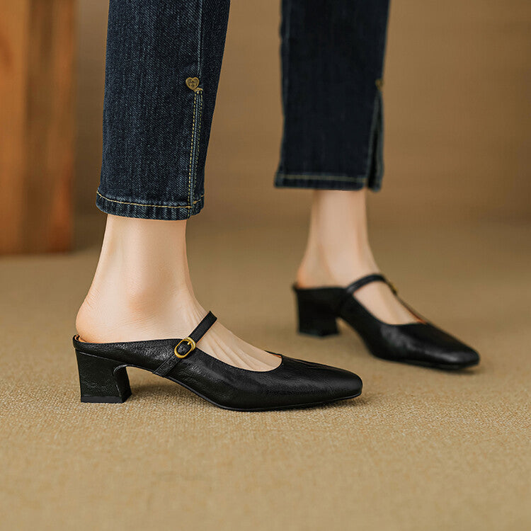 Black leather pointed-arch mule with low block heel and buckle strap