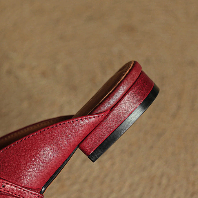 Maroon leather mule outsole and heel edge close-up with rubber sole