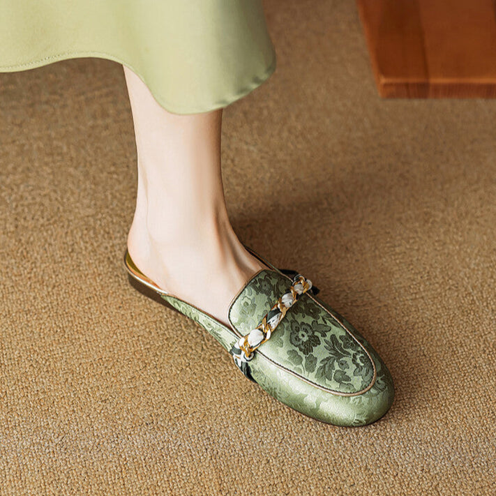 Green genuine leather mules with floral print and bow ornament, low flat sole