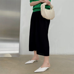 White pointed-toe mules with low heel and slip-on backless design