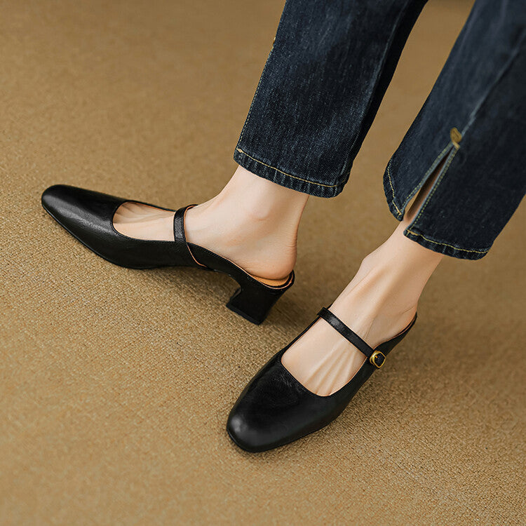 Black leather mules with wide strap and oval buckle, low block heel