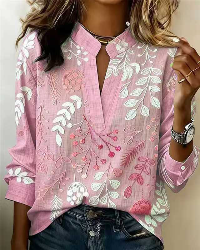 Blush pink embroidered popover blouse with V-neck and 3/4 sleeves, floral vine design