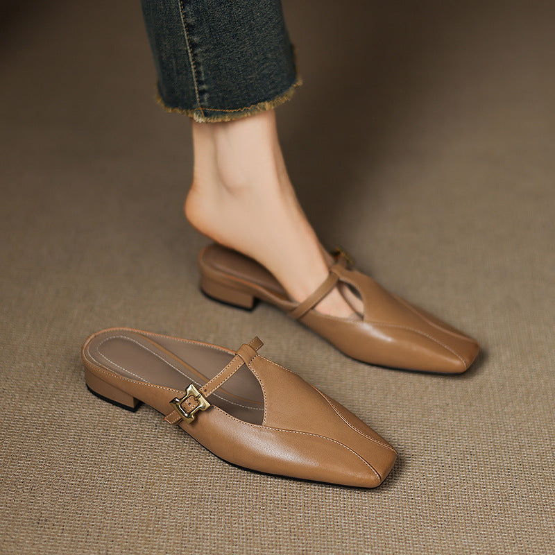 Brown leather mules with open toe strap and gold buckle on low block heel