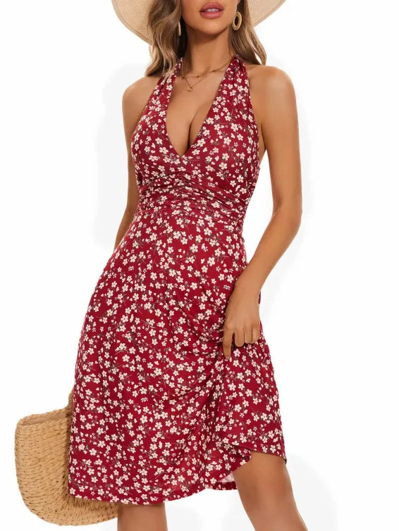 Red floral halter line dress with fitted bodice and tiered skirt