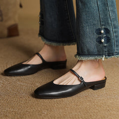 Black leather pointed-toe mules with T-strap and low block heel