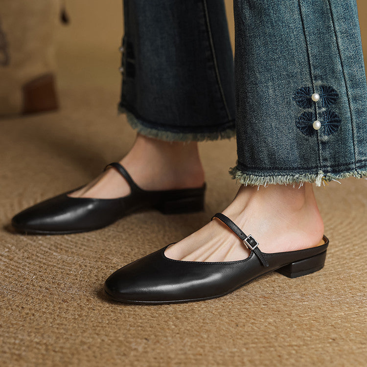 Black leather pointed-toe mules with T-strap and low block heel