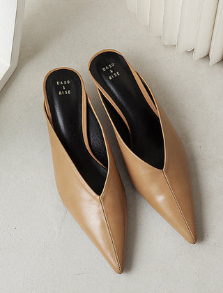 Brown pointed-toe slip-on mules with low heel and smooth finish