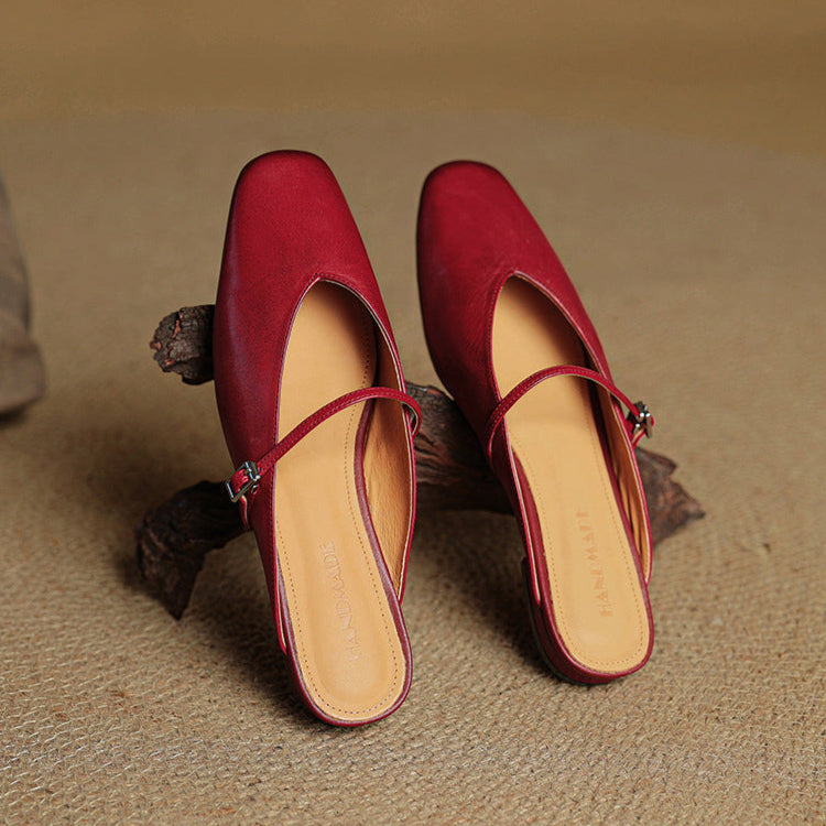 Maroon leather mules shown side-by-side with slingback strap and buckle
