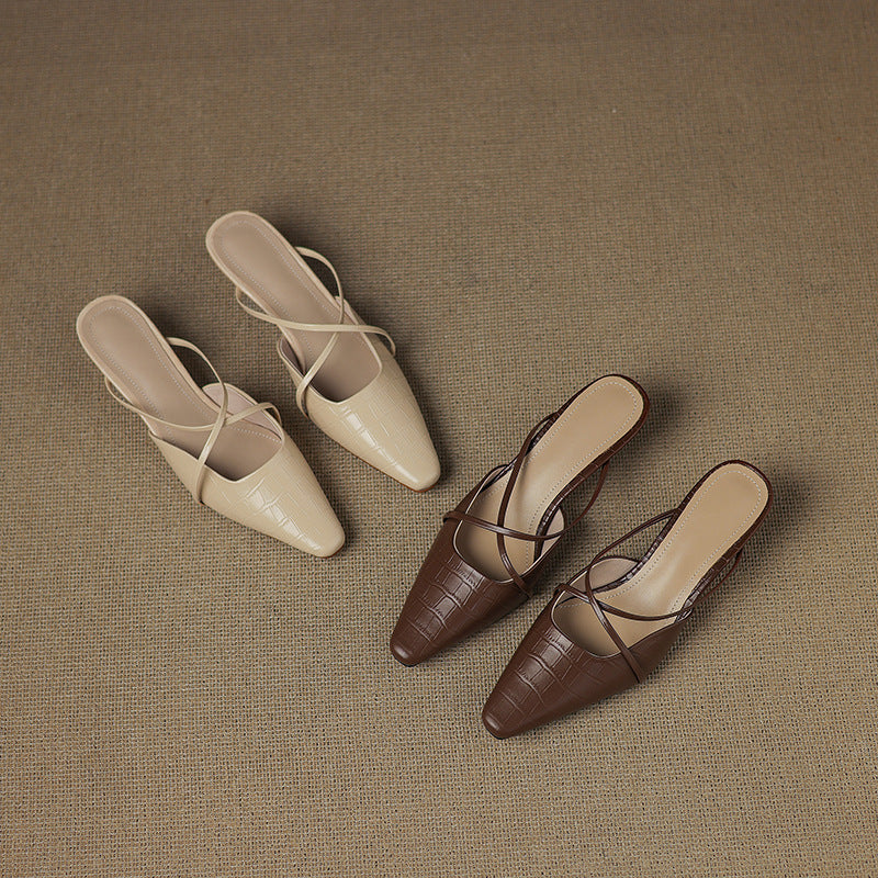 Beige and brown leather mules with crisscross straps, pointed toe, low heel