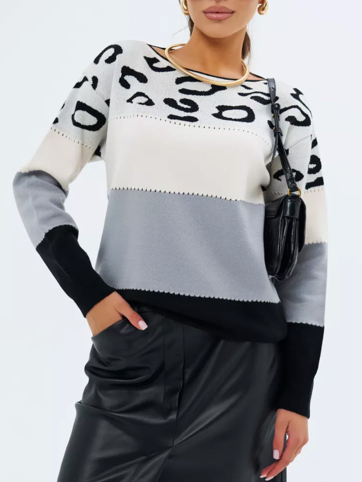 Leopard-print crewneck knit sweater with white upper and light gray lower panel