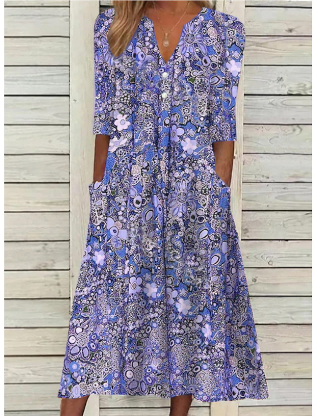 Blue floral printed midi dress with V-neck and three-quarter sleeves