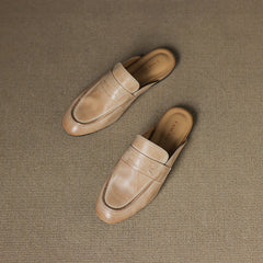 Beige leather mules pair, slip-on style with stitched vamp lines