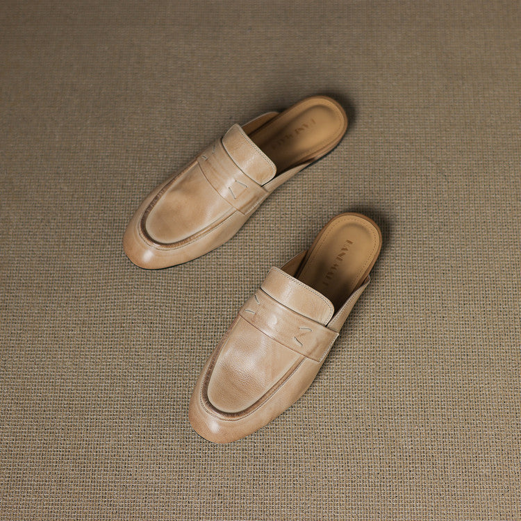 Beige leather mules pair, slip-on style with stitched vamp lines
