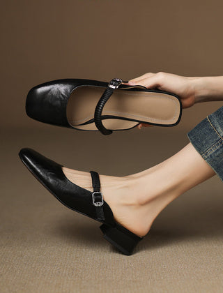 Black leather Mary Jane mule flats with ankle strap and silver buckle, low heel