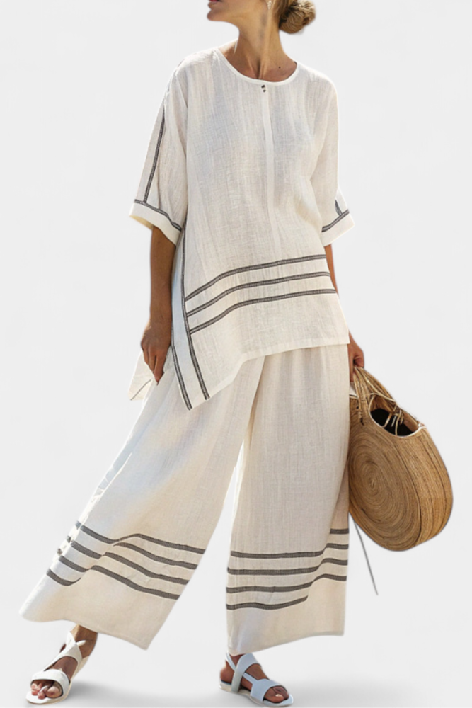 White striped asymmetrical top and wide-leg pants set with bold horizontal banding