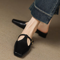 Black leather mules with open toe cutout and ankle strap, low heel view