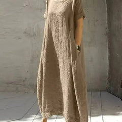 Beige casual maxi dress with short sleeves and round neckline, loose gathered fabric