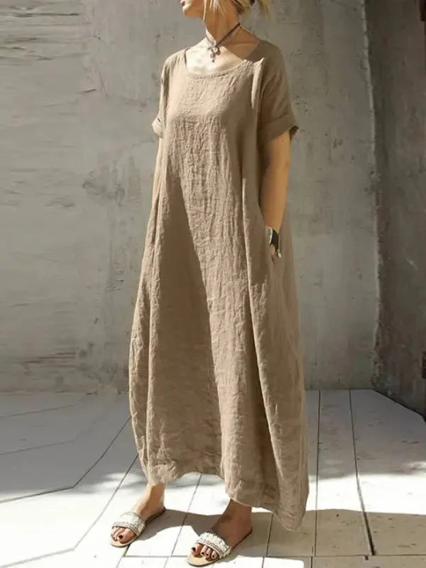 Beige casual maxi dress with short sleeves and round neckline, loose gathered fabric