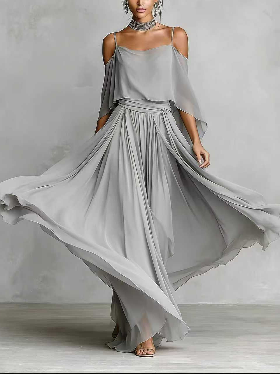 Light grey draped cold-shoulder maxi dress with cape sleeves and gathered pleated skirt