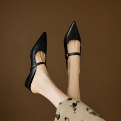 Black genuine leather mule, open back design and low heel, pointed toe.