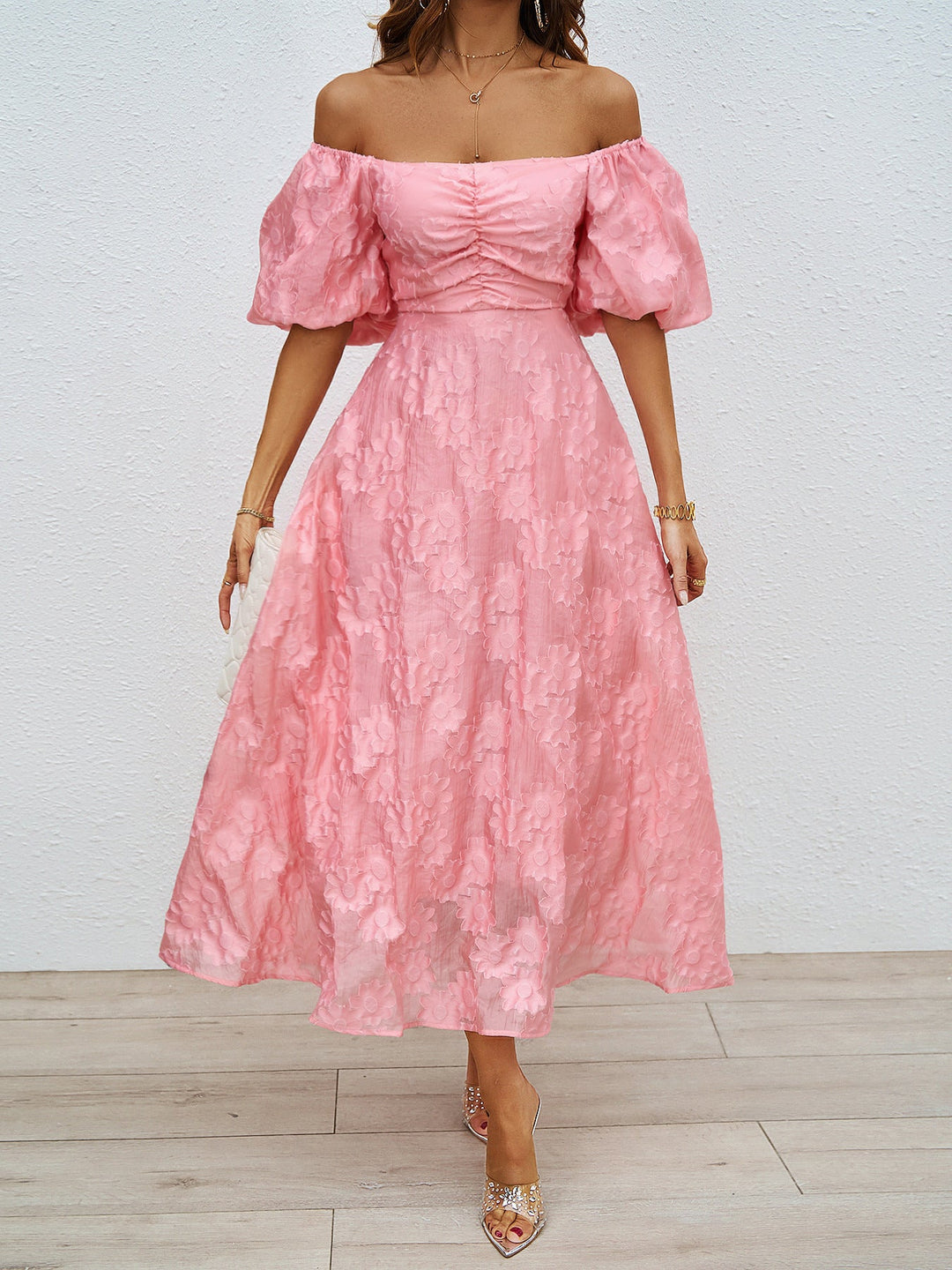 Pink off-shoulder midi dress with puff sleeves and ruched neckline