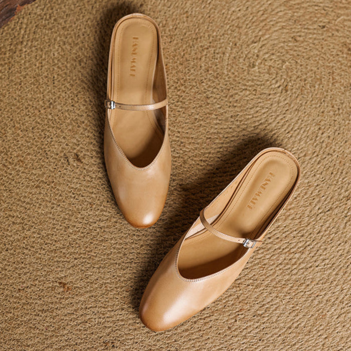 Apricot genuine leather slip-on mules with adjustable strap and buckle detail