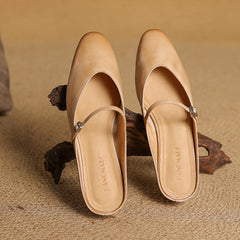 Apricot genuine leather mules pair with slip-on strap, buckles, and rounded toe