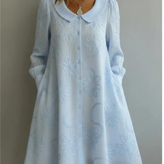 Light blue embroidered midi dress with V-neck and long sleeves, flare skirt