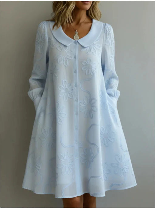 Light blue embroidered midi dress with V-neck and long sleeves, flare skirt