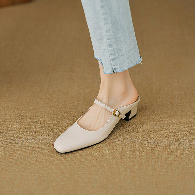 Beige leather mule with round toe, side strap, and low block heel.