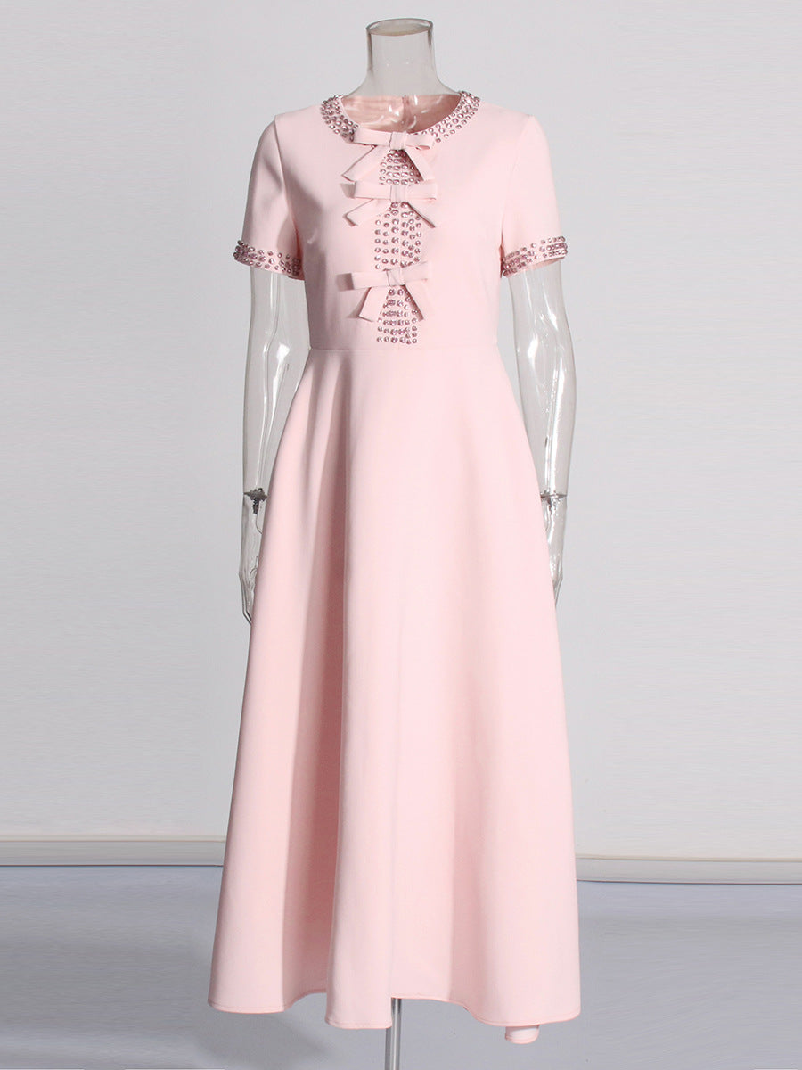 Light pink midi dress with lace-trim bow neckline and short sleeves
