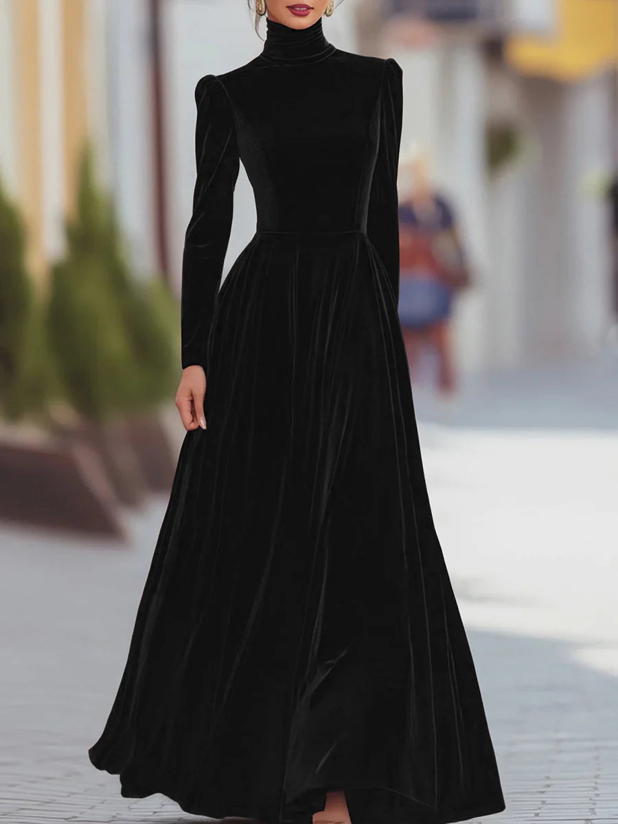 Black velvet dress with high neck, long sleeves, fitted bodice, flared skirt