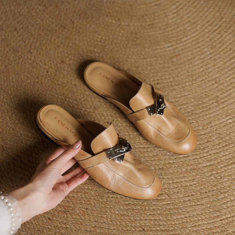 Tan leather slip-on mules with square toe and silver buckle strap, shown together