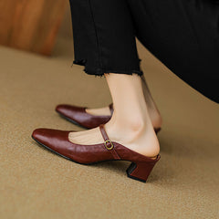 Maroon leather mule, pointed toe, low block heel, sling strap with gold buckle