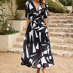 Black and white abstract print midi dress with V-neck and gathered waist