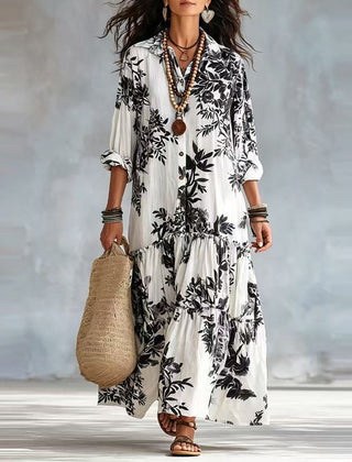 Tiered button-down maxi dress with black floral print and three-quarter sleeves