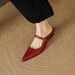 Maroon leather mules with thin slingback strap and small round buckle detail