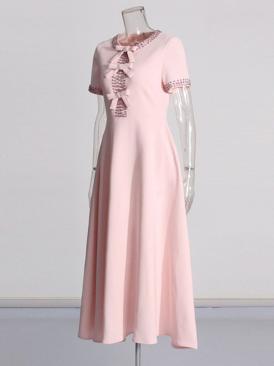 Pink midi dress with lace collar and bow ties, short sleeves