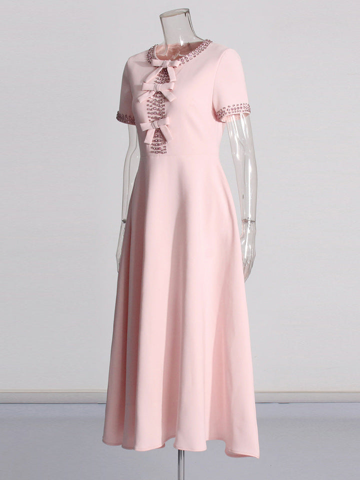 Pink midi dress with lace collar and bow ties, short sleeves
