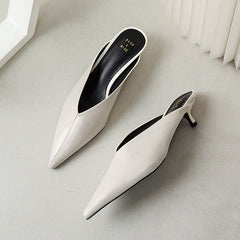 White pointed-toe slip-on mules with low block heel