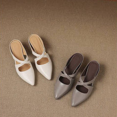 Pair of white and gray pointed-toe cross-strap mules with low block heels