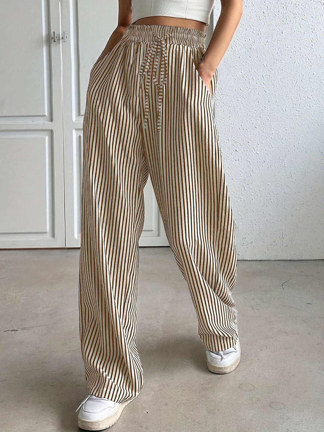 Brown striped trousers with drawstring waist and wide leg