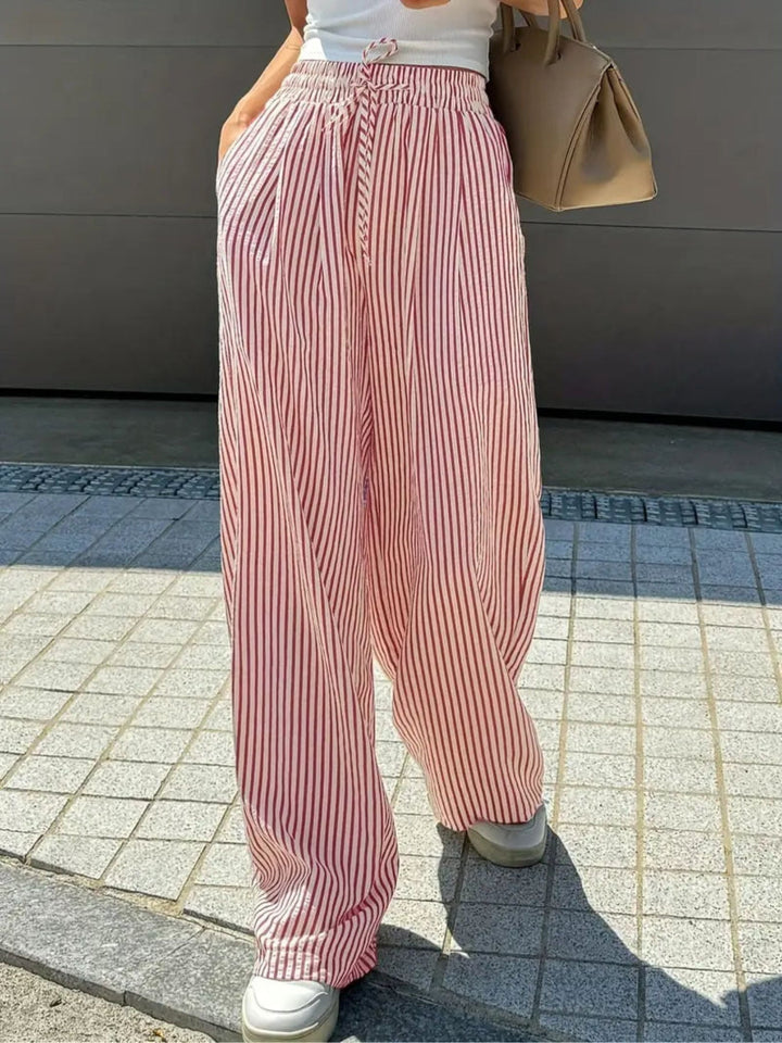 Pink-red striped trousers with elastic drawstring waist and wide legs
