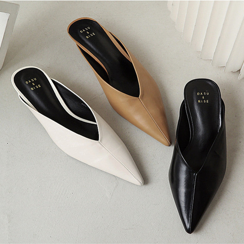 Pointed-toe mules in white, tan, and black with slip-on design and low heels
