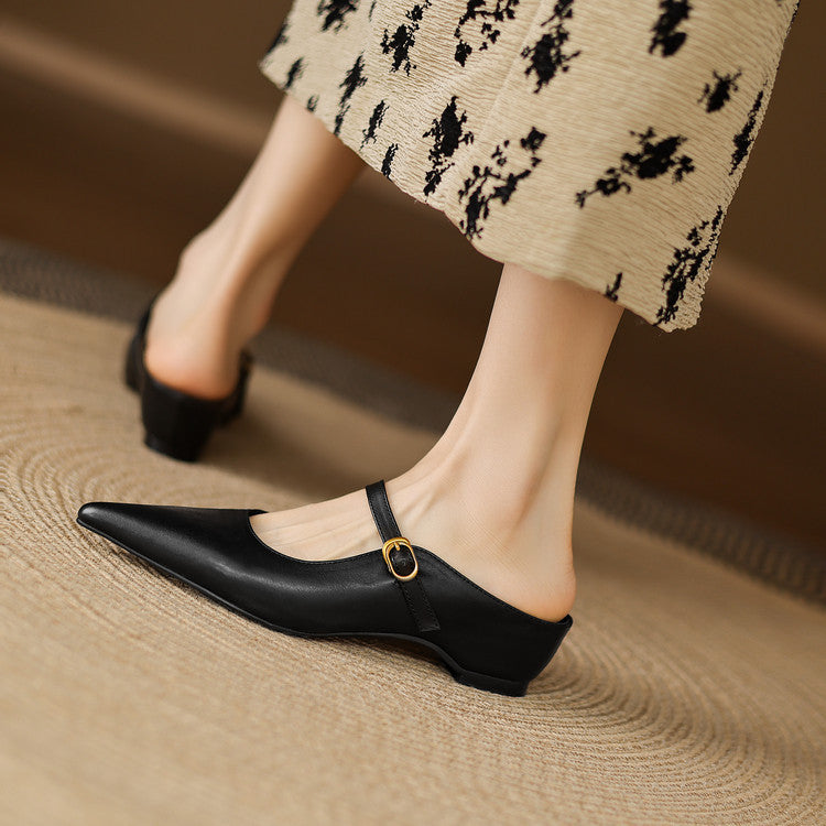 Black genuine leather mule on foot, low heel, pointed toe, ring buckle strap.
