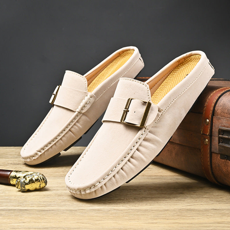 Pair of cream suede mules with square buckle strap and side stitch detailing