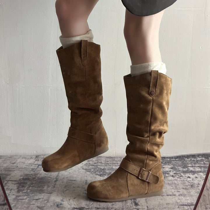Brown suede flat-sole orthopedic boots with buckle ankle strap and side zipper